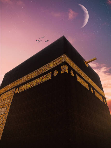The black building of the kaaba in mecca. Kaaba with moon. Mecca,Saudi Arabia. The black building of the kaaba in mecca. Kaaba with moon. Mecca,Saudi Arabia.